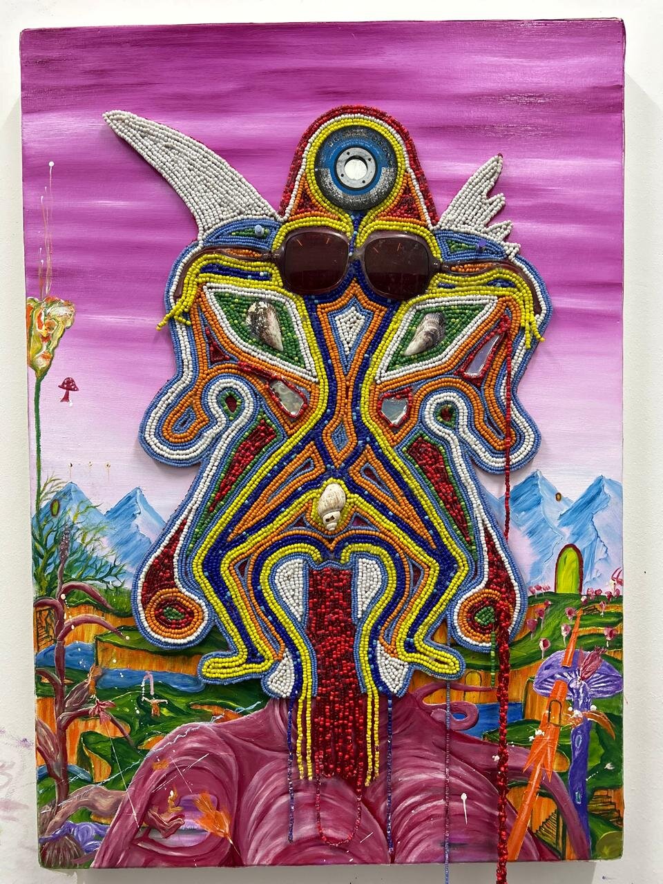 *Title*: O bona moo o shebileng
*Artist*: Sechaba Nyenye
*Series*: Badimo

Tittle - O bona moo o shebileng

This work,interrogates the politics of the gaze through the HOHA flat mask language. The work positions the ancestral mask as active witness rather than passive subject, reversing the traditional viewer-artwork dynamic. Drawing from Basotho philosophy where seeing is an intentional and spiritual act, the painting explores surveillance, self-awareness, and ancestral accountability. By flattening facial features to a singular, piercing gaze, the artist creates a mirror that implicates the viewer — asking not what is seen, but where and why one chooses to look.